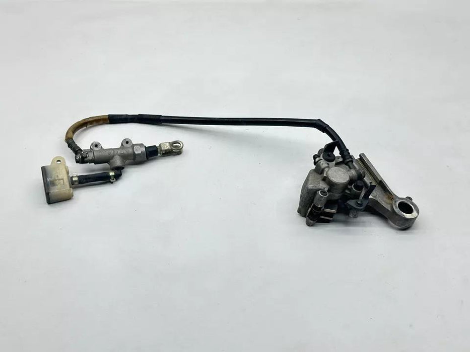 2000 Suzuki RM125 Nissin Rear Brake Assembly Master Cylinder Caliper Bracket